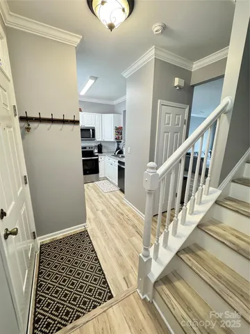 a view of entryway with wooden floor