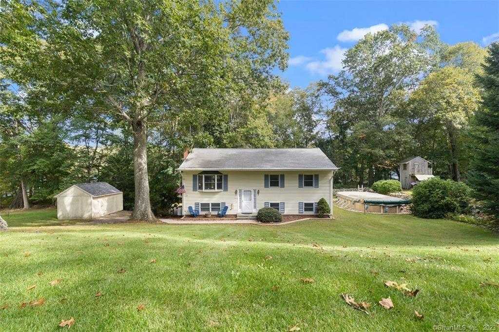 11 Kevin Road East Lyme, CT 06357 - Photo 1 of 1 a front view of a house with garden