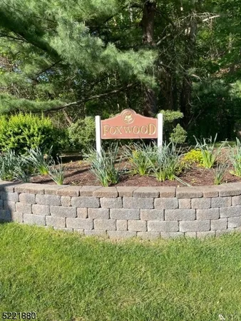 a view of house with yard and outdoor seating
