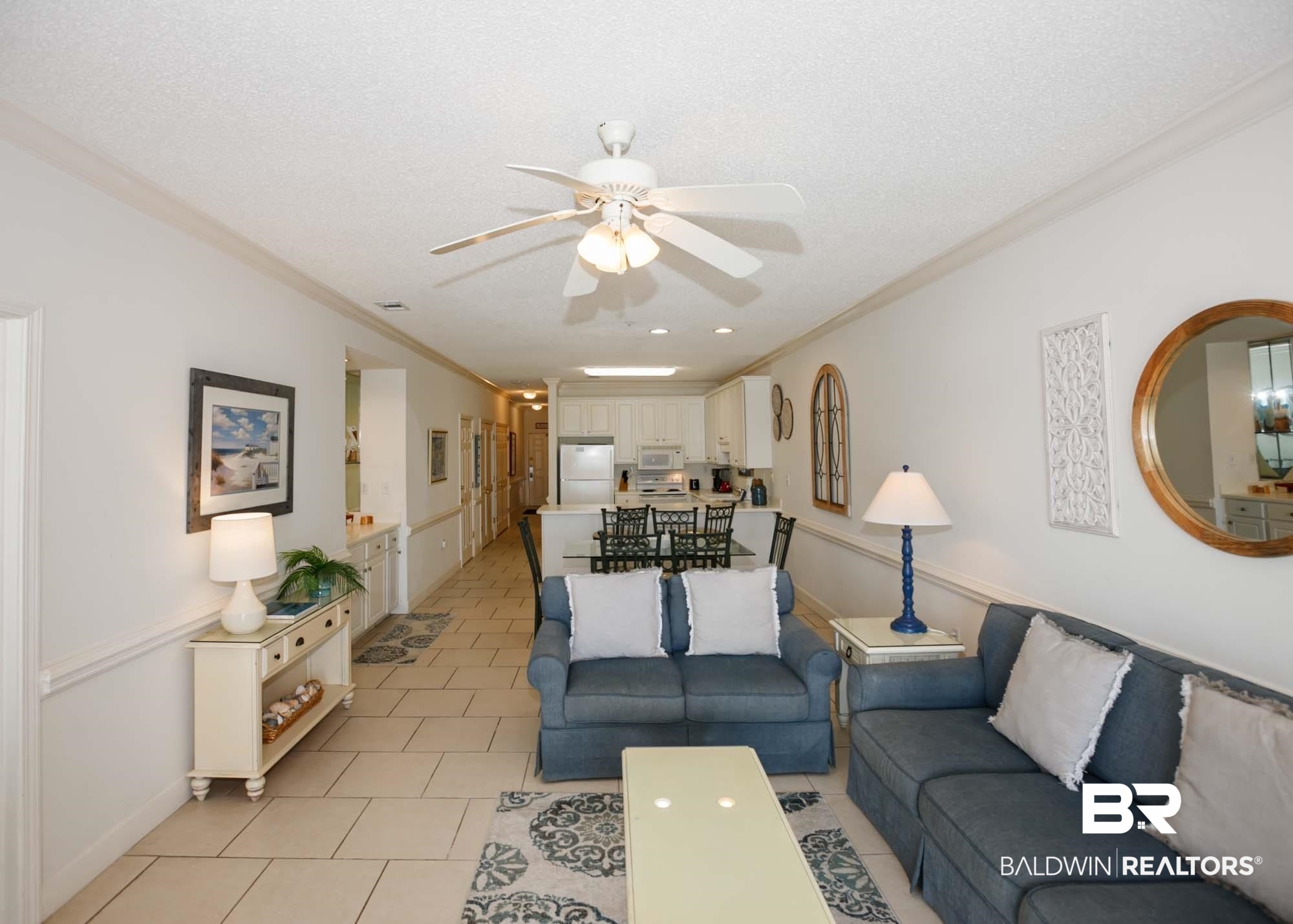 28910 Perdido Beach Boulevard, Unit 4B Orange Beach, AL 36561 - Photo 16 of 48 Living area featuring light tile patterned floors, crown molding, a textured ceiling, and ceiling fan