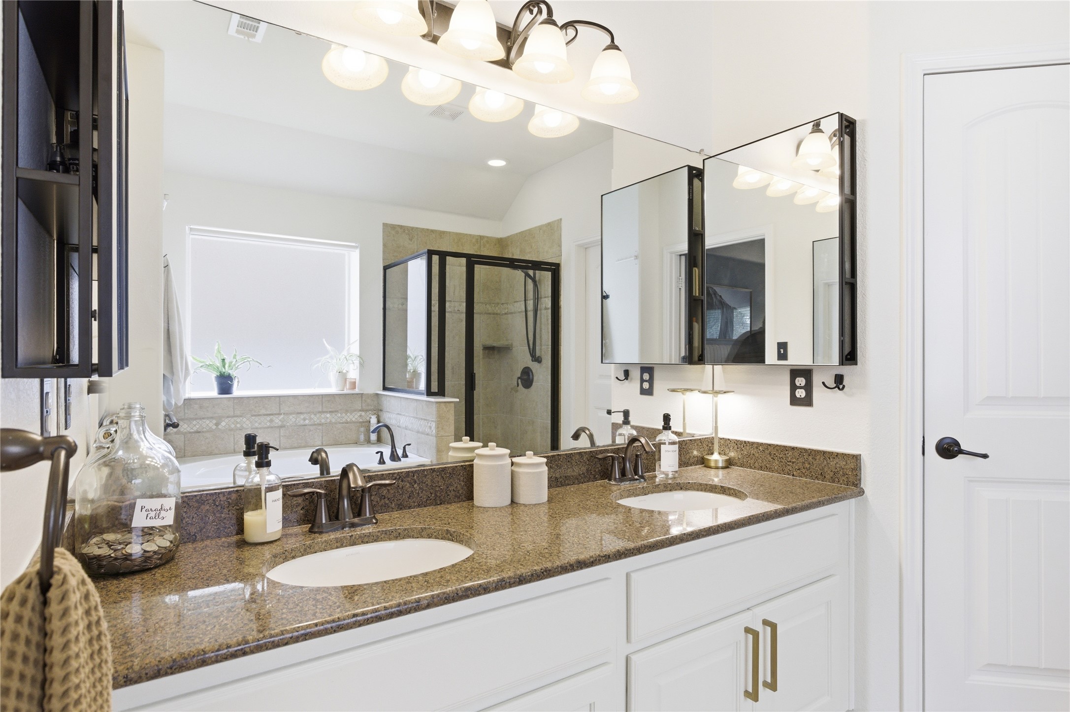 1312 Rimstone Drive Cedar Park, TX 78613 - Photo 13 of 25 a bathroom with double vanity sinks and a mirror