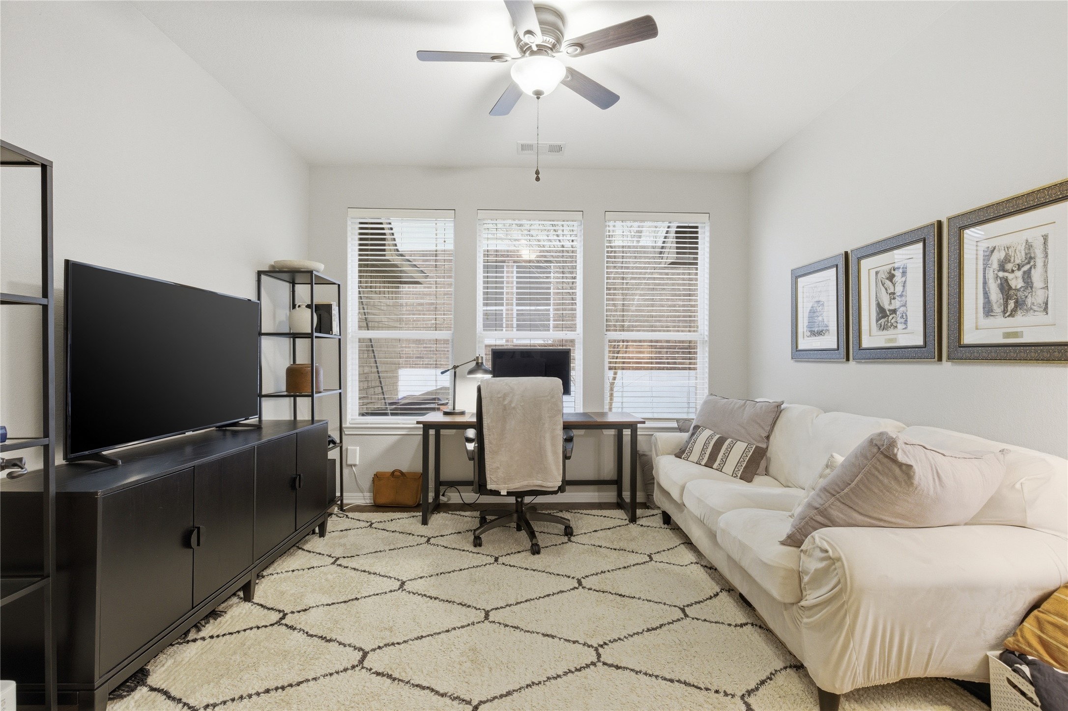 1312 Rimstone Drive Cedar Park, TX 78613 - Photo 15 of 25 a living room with furniture and a flat screen tv