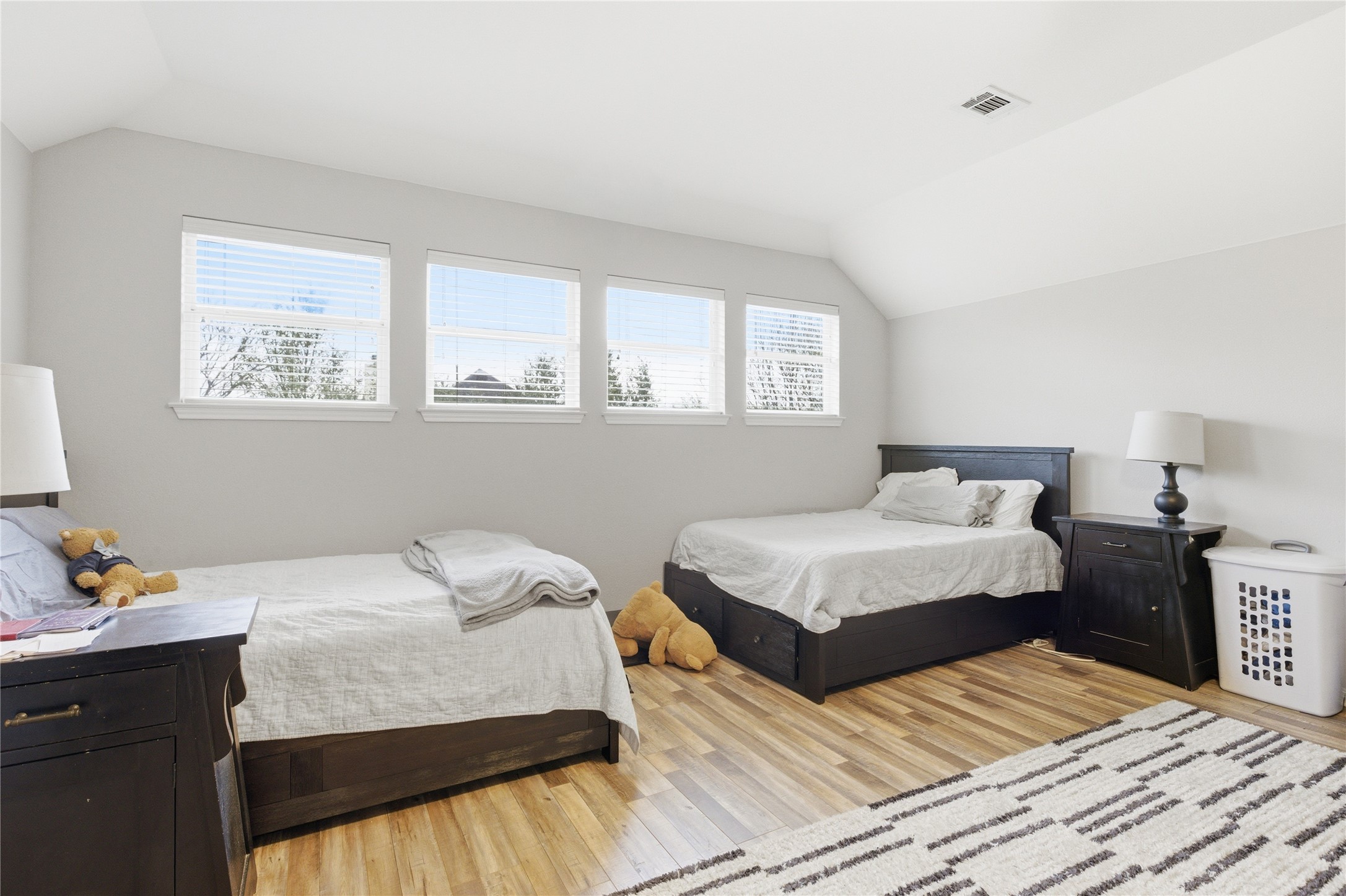 1312 Rimstone Drive Cedar Park, TX 78613 - Photo 16 of 25 a bedroom with a bed and wooden floor