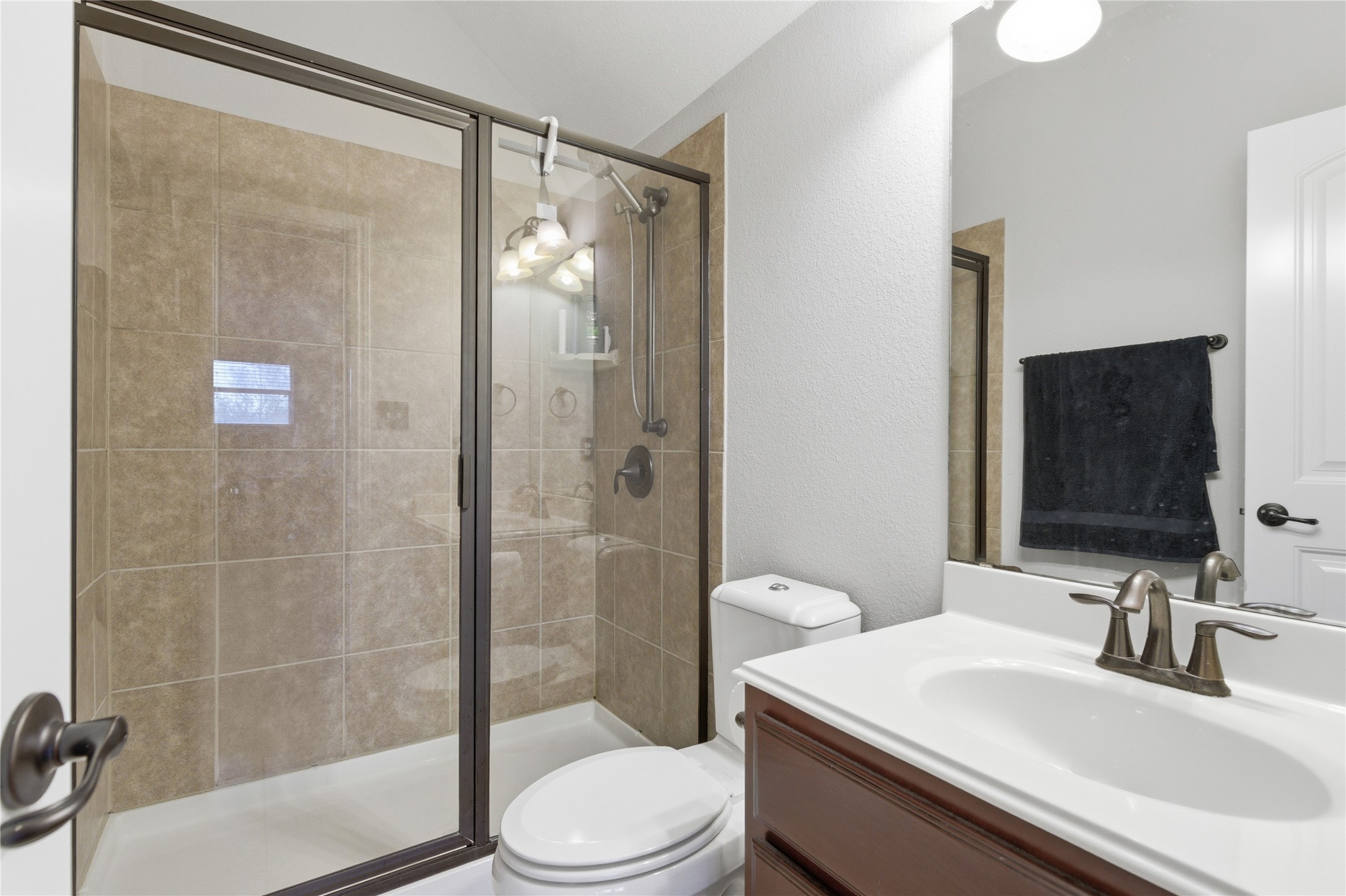 1312 Rimstone Drive Cedar Park, TX 78613 - Photo 17 of 25 a bathroom with a sink a toilet and shower