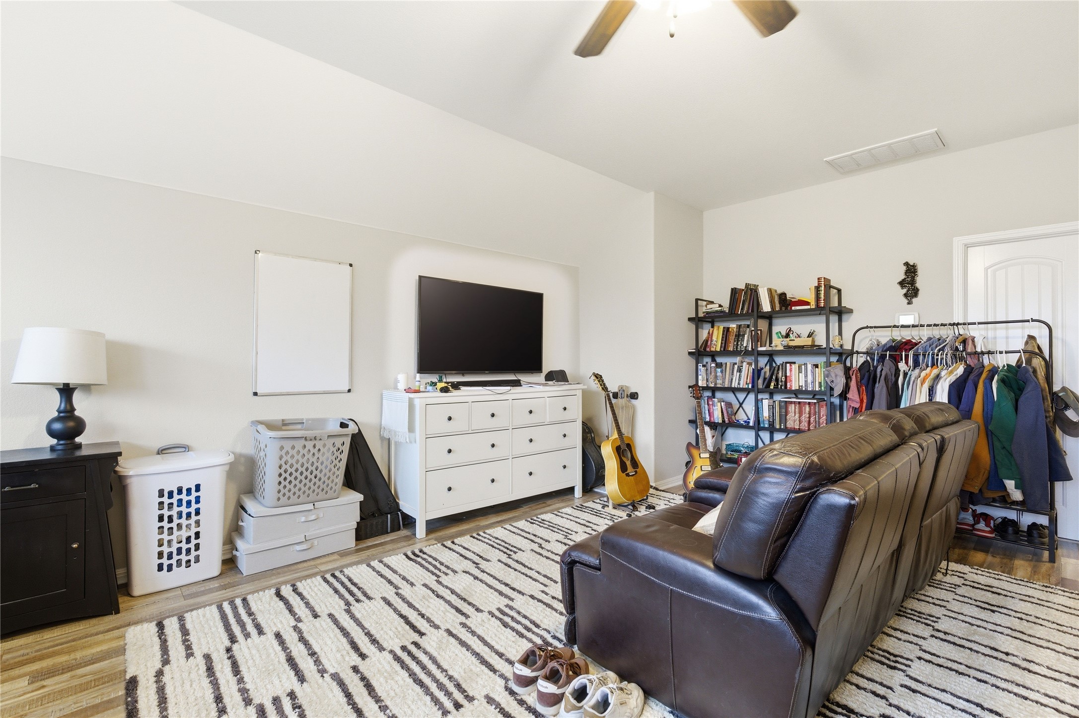 1312 Rimstone Drive Cedar Park, TX 78613 - Photo 18 of 25 a living room with furniture and a flat screen tv