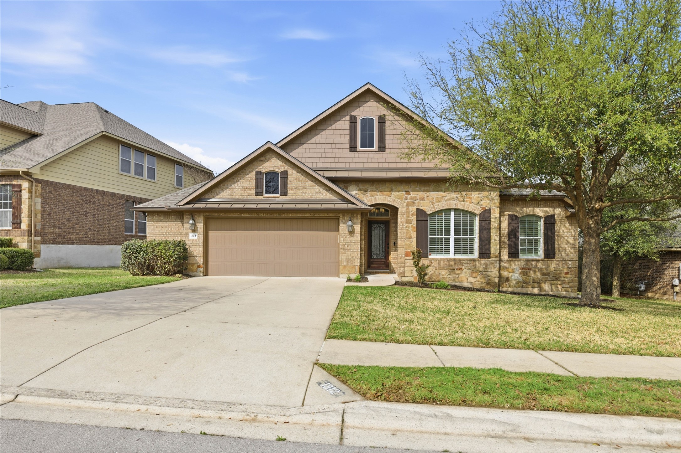 1312 Rimstone Drive Cedar Park, TX 78613 - Photo 2 of 25 front view of a house and a yard