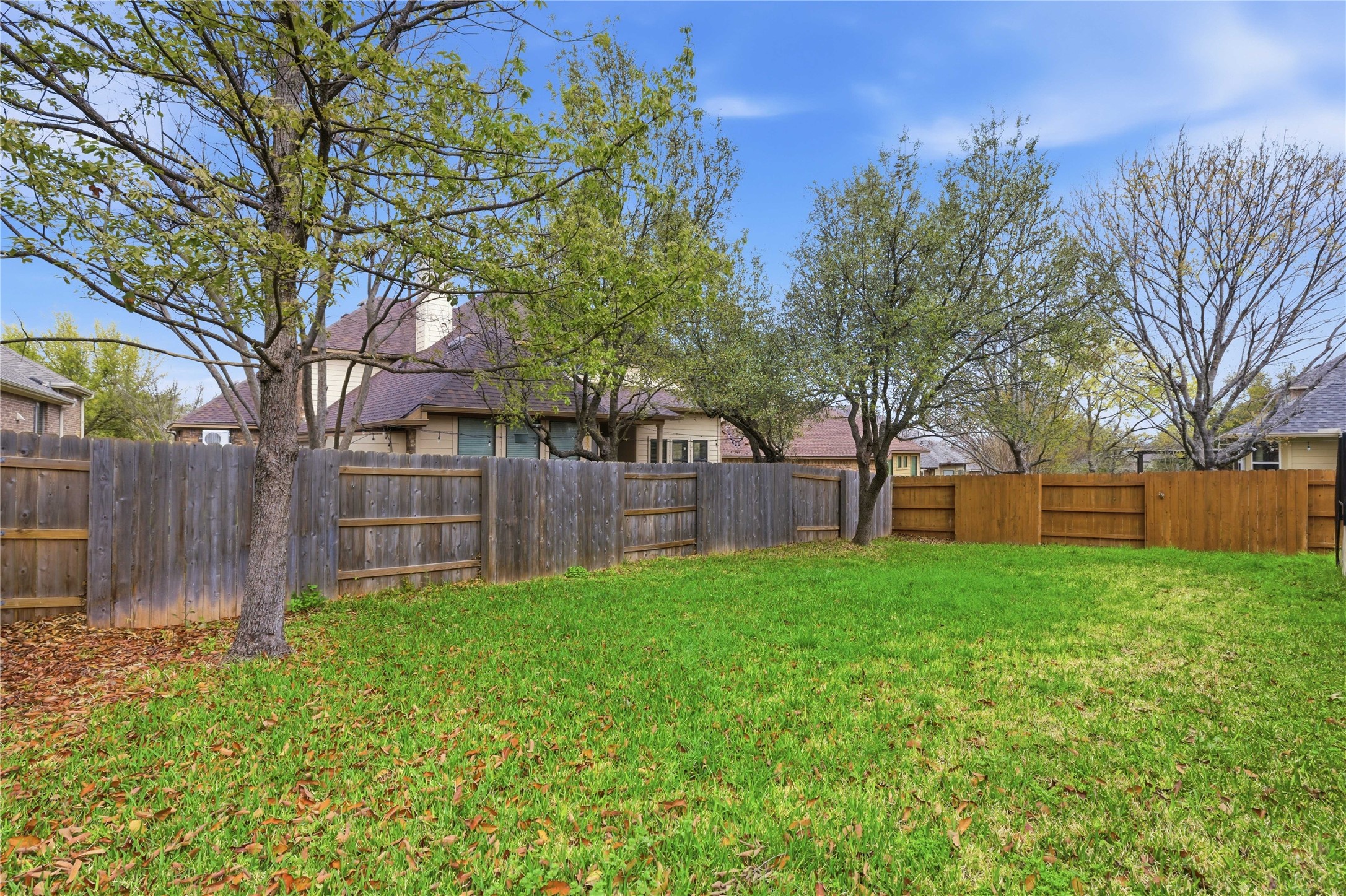 1312 Rimstone Drive Cedar Park, TX 78613 - Photo 21 of 25 a backyard of a house with lots of green space