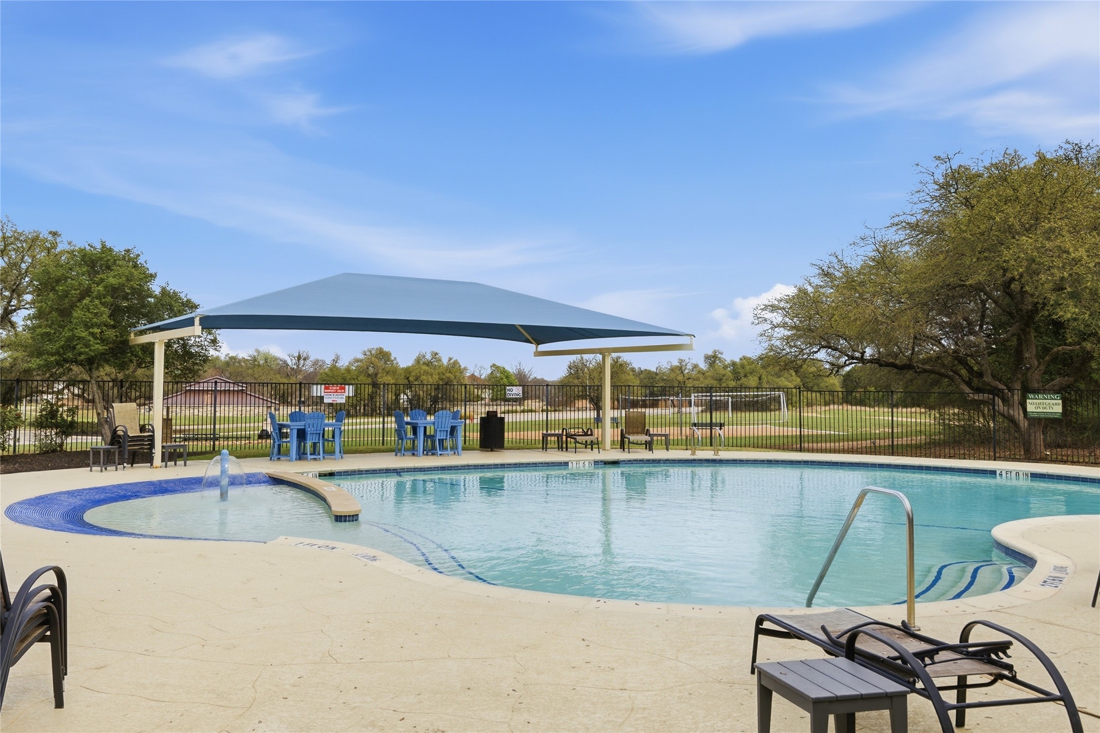 1312 Rimstone Drive Cedar Park, TX 78613 - Photo 24 of 25 a view of a swimming pool with chairs