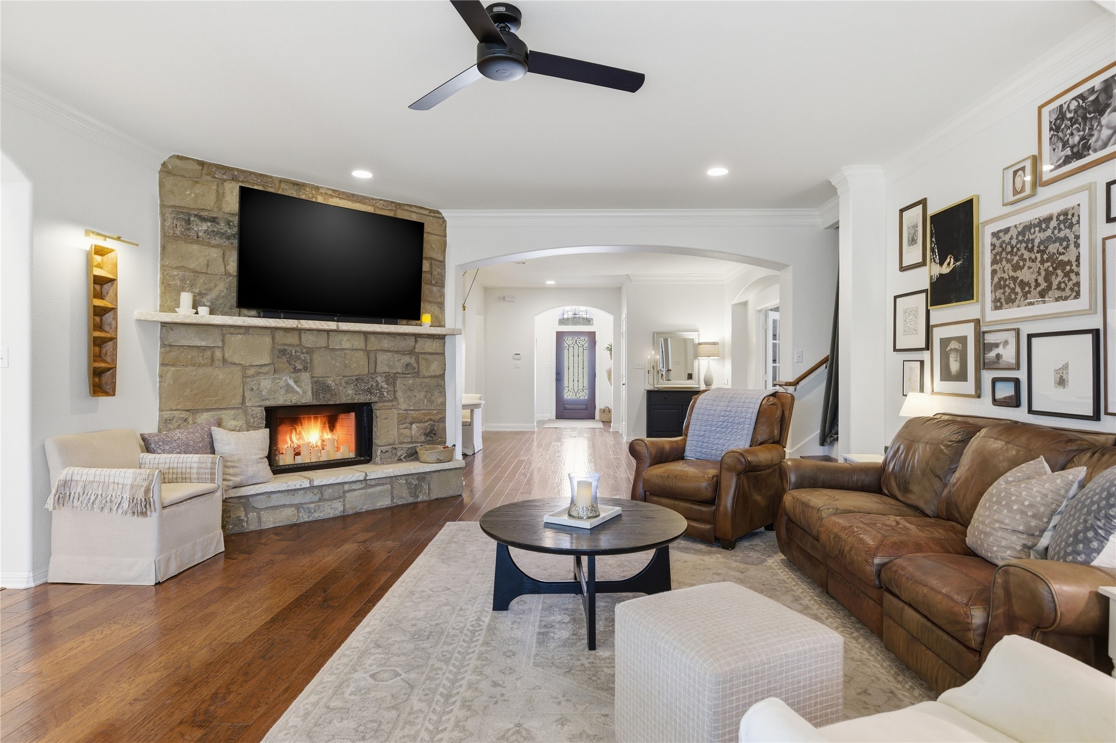 1312 Rimstone Drive Cedar Park, TX 78613 - Photo 4 of 25 a living room with furniture fireplace and a flat screen tv