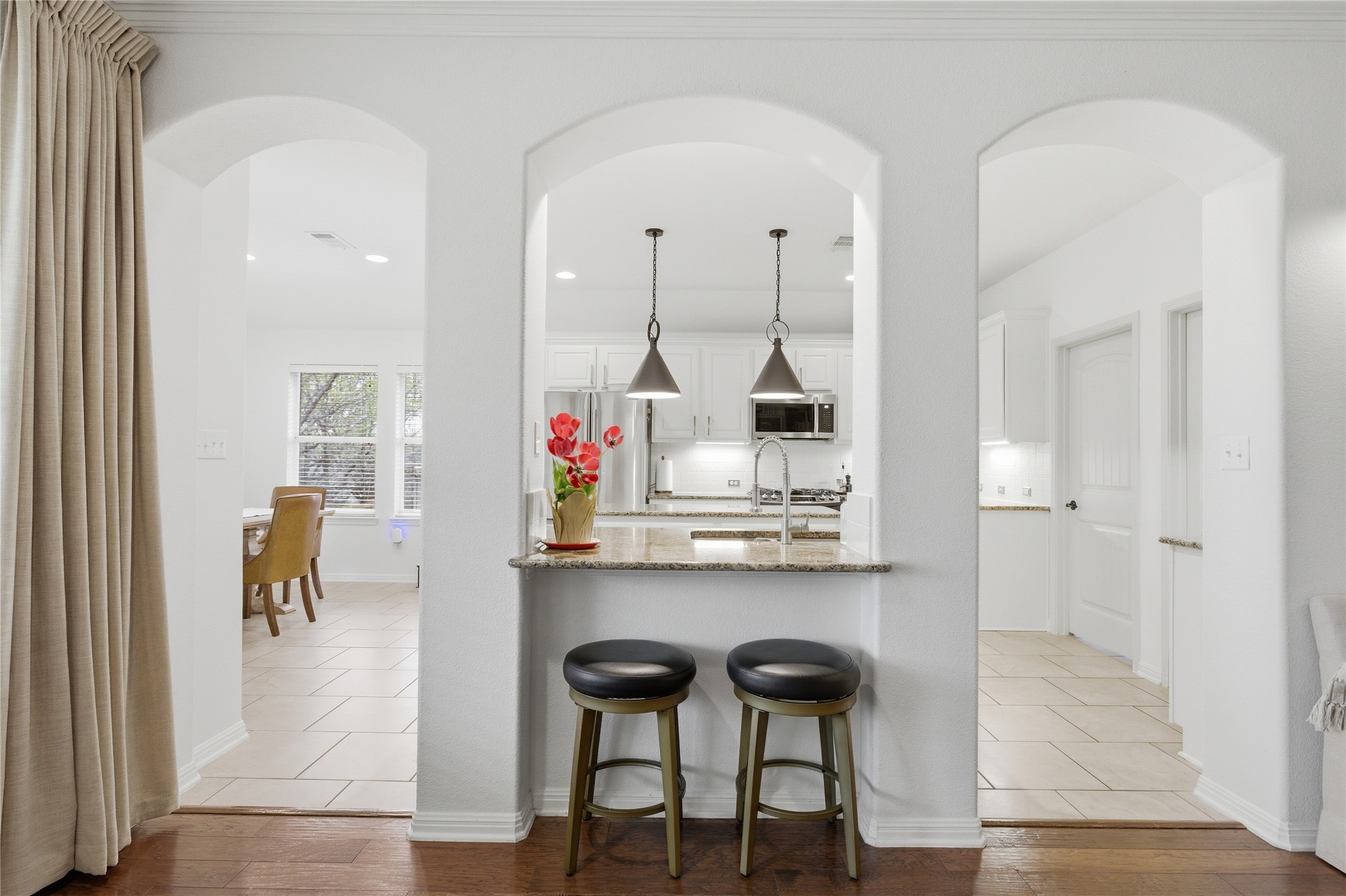 1312 Rimstone Drive Cedar Park, TX 78613 - Photo 6 of 25 a view of kitchen island with furniture and wooden floor