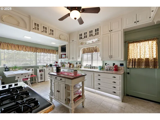 a kitchen with stainless steel appliances a stove and a refrigerator