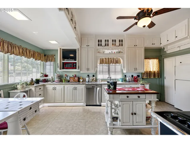 a kitchen with a stove and cabinets