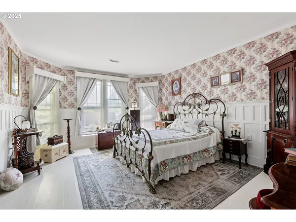 a bedroom with a bed with window