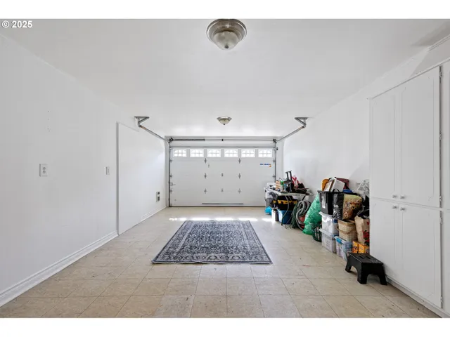 a view of a livingroom with furniture and a window
