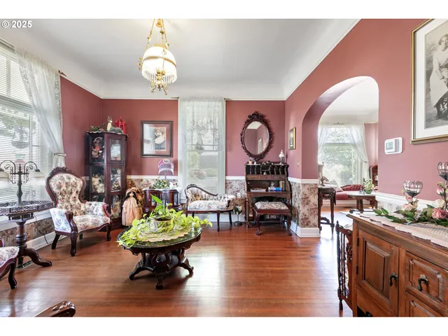 a living room with furniture a rug and a chandelier