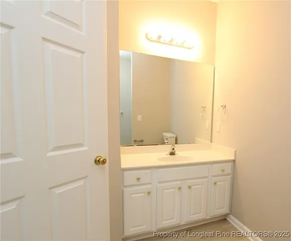 a bathroom with a sink a mirror and a shower