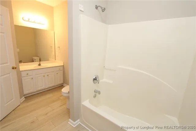 a bathroom with a bathtub and a sink