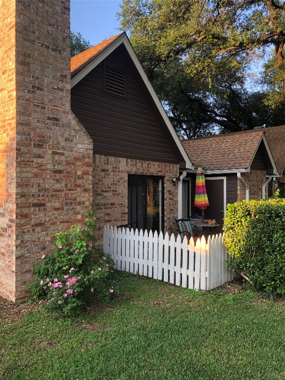 1601 Faro Drive, Unit 1704 Austin, TX 78741 - Photo 11 of 26 a front view of a house with a garden