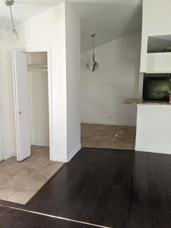 1601 Faro Drive, Unit 1704 Austin, TX 78741 - Photo 15 of 26 a view of a room with wooden floor and a sink