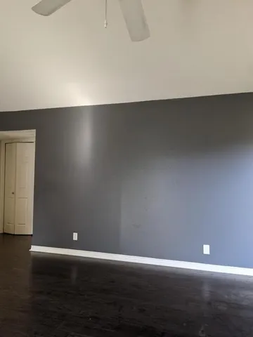 a view of room with wooden floor