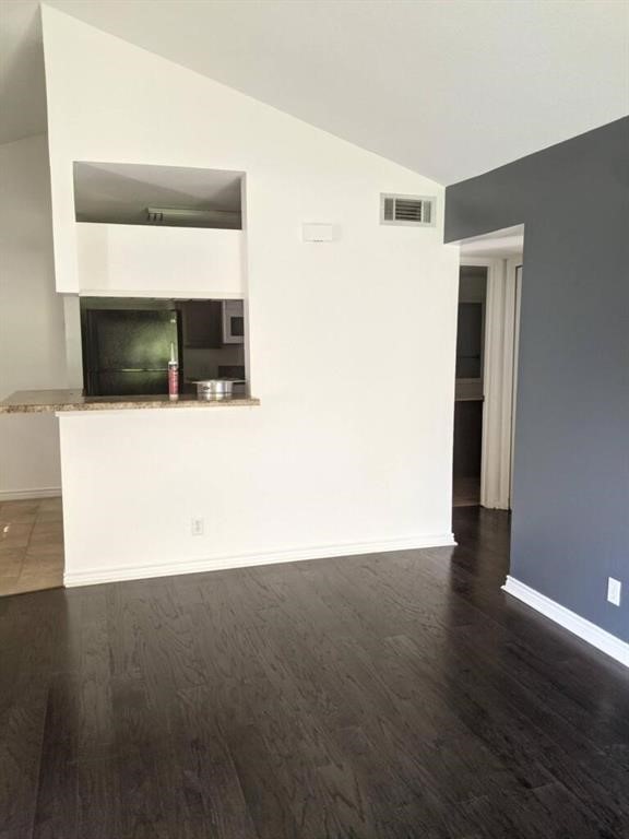 1601 Faro Drive, Unit 1704 Austin, TX 78741 - Photo 20 of 26 a view of a hallway with wooden floor and a cabinet