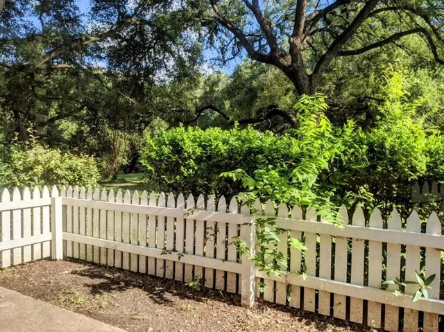 a view of a wooden fence