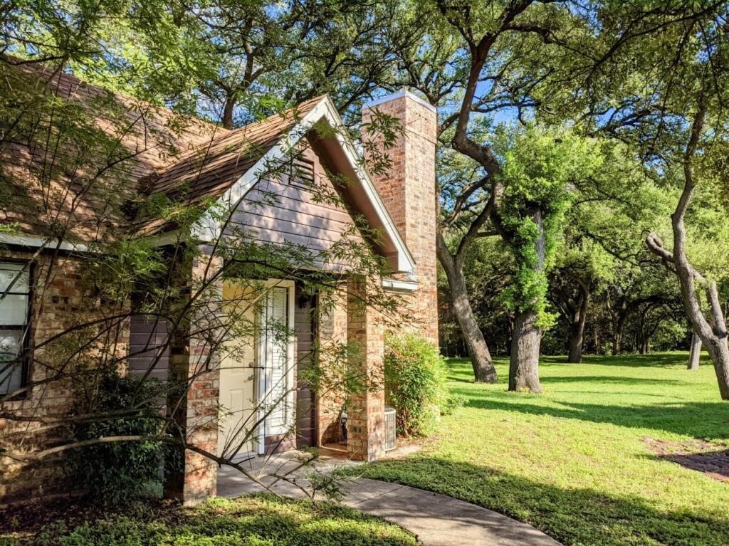 1601 Faro Drive, Unit 1704 Austin, TX 78741 - Photo 25 of 26 a view of a house with a yard