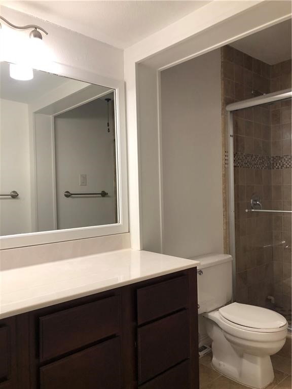 1601 Faro Drive, Unit 1704 Austin, TX 78741 - Photo 26 of 26 a bathroom with a sink a toilet and shower