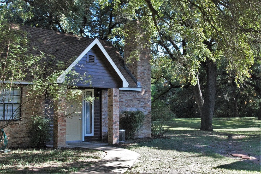 1601 Faro Drive, Unit 1704 Austin, TX 78741 - Photo 8 of 26 a front view of a house with a yard