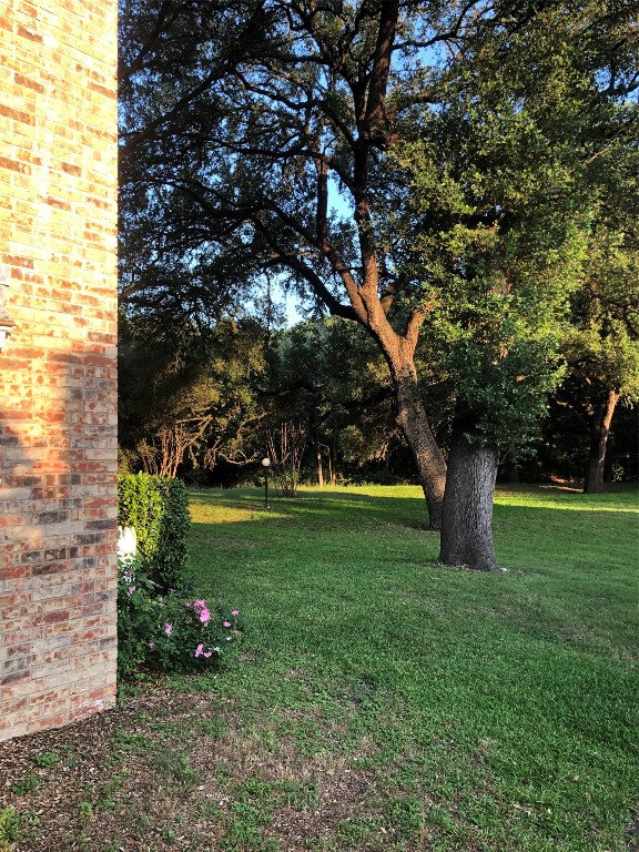 1601 Faro Drive, Unit 1704 Austin, TX 78741 - Photo 10 of 26 a view of a tree in front of a house