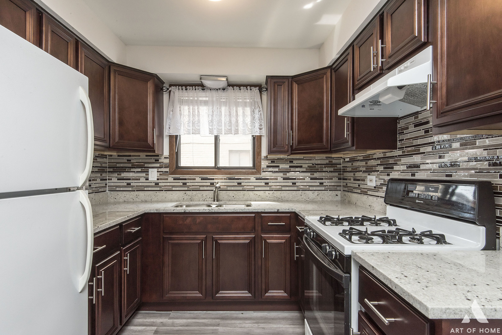 10612 Ridgemont Lane Chicago Ridge, IL 60415 - Photo 4 of 32 a kitchen with a stove sink and cabinets