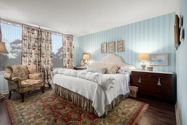 a bedroom with bed and a couch