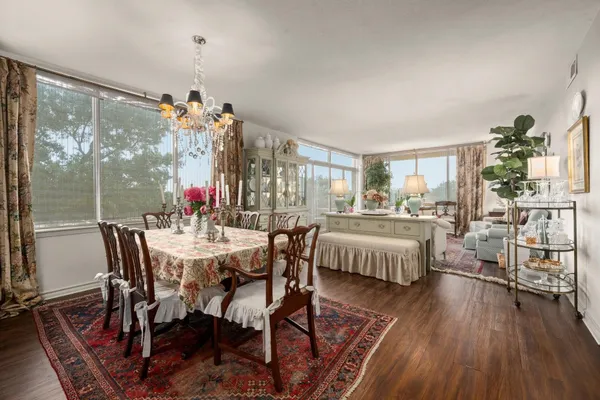 a view of a dining room with furniture window and wooden floor