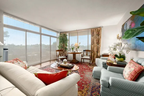 a living room with furniture and a large window