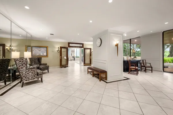 a lobby with furniture and wooden floor