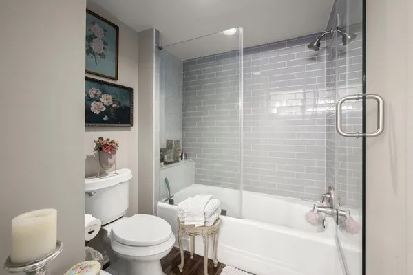 a bathroom with a toilet sink and shower