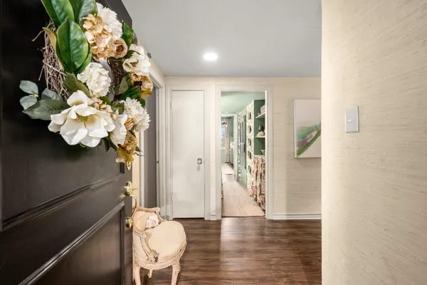 a view of a hallway with wooden floor