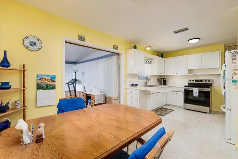 a kitchen with a sink appliances and cabinets