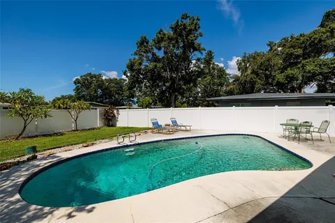 a view of a pool with a yard