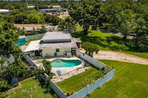 an aerial view of a house having yard