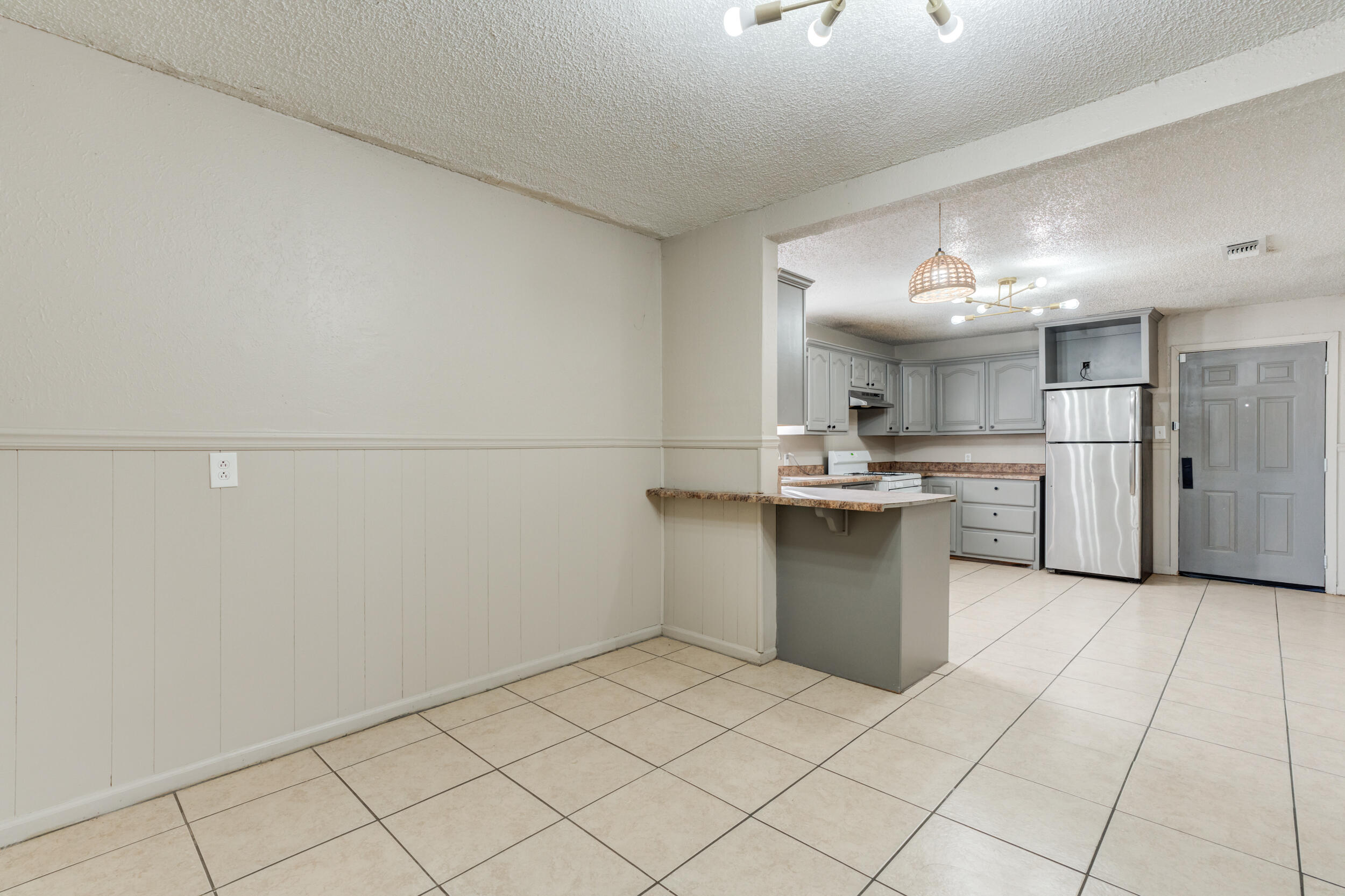 3109 Harvard Street Lubbock, TX 79415 - Photo 14 of 29 a kitchen with a sink cabinets and stainless steel appliances