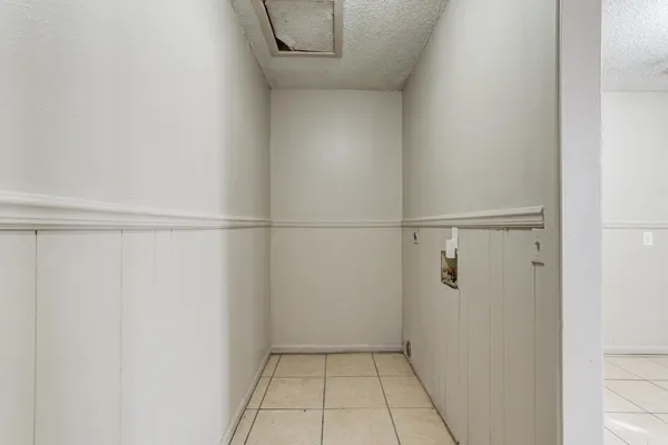 a view of a room with racks on the wall
