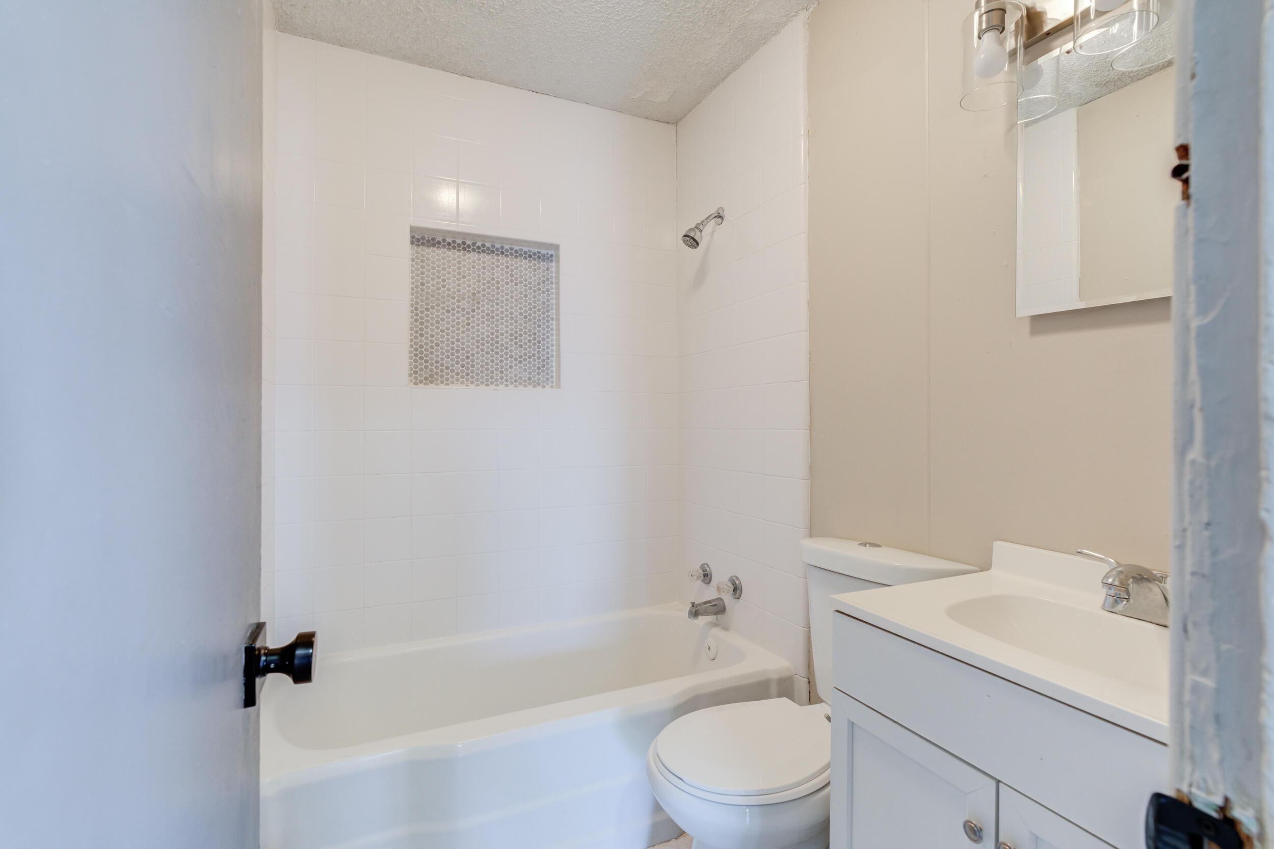 3109 Harvard Street Lubbock, TX 79415 - Photo 20 of 29 a bathroom with a sink a toilet and bathtub