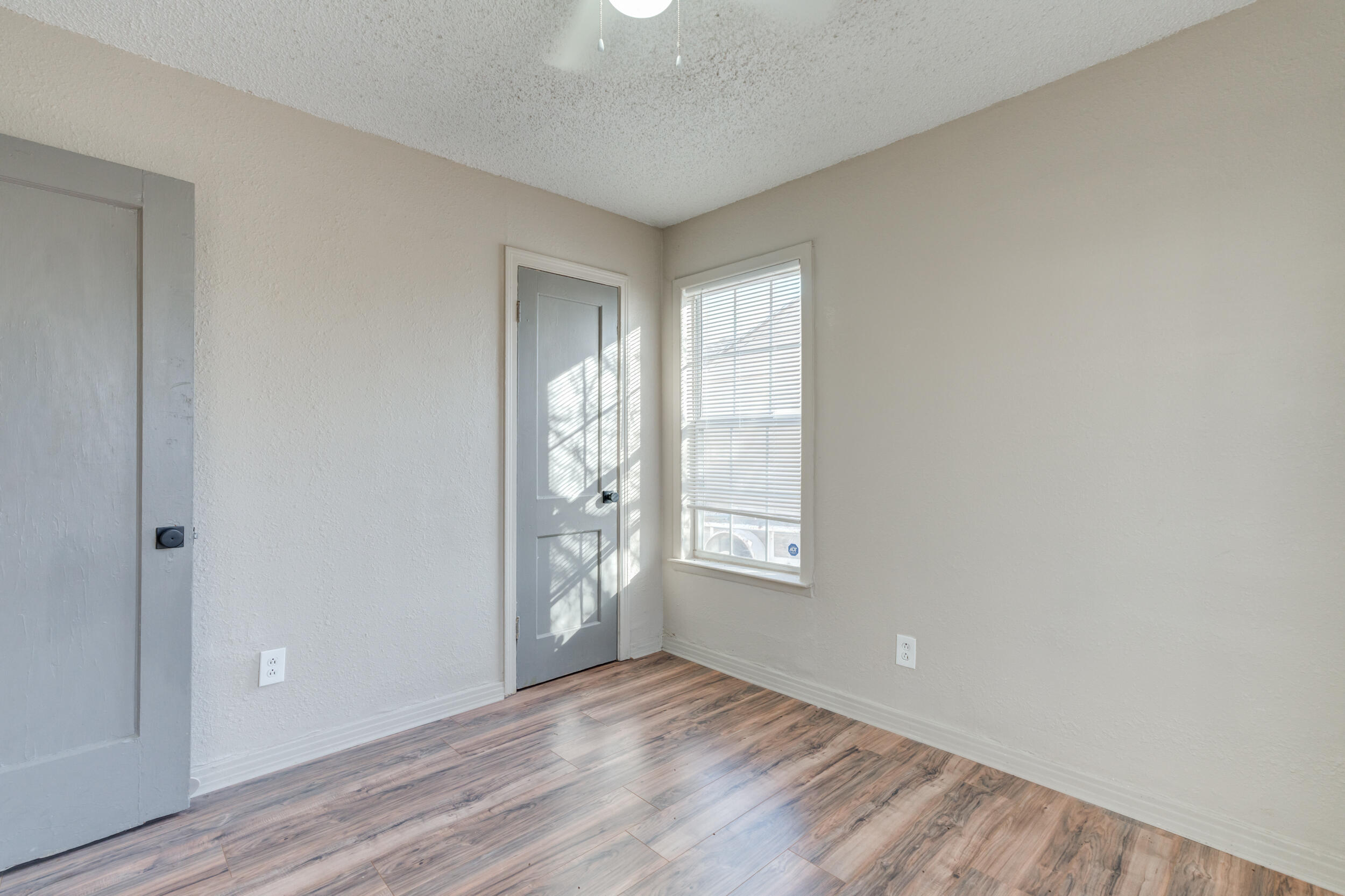3109 Harvard Street Lubbock, TX 79415 - Photo 22 of 29 an empty room with windows