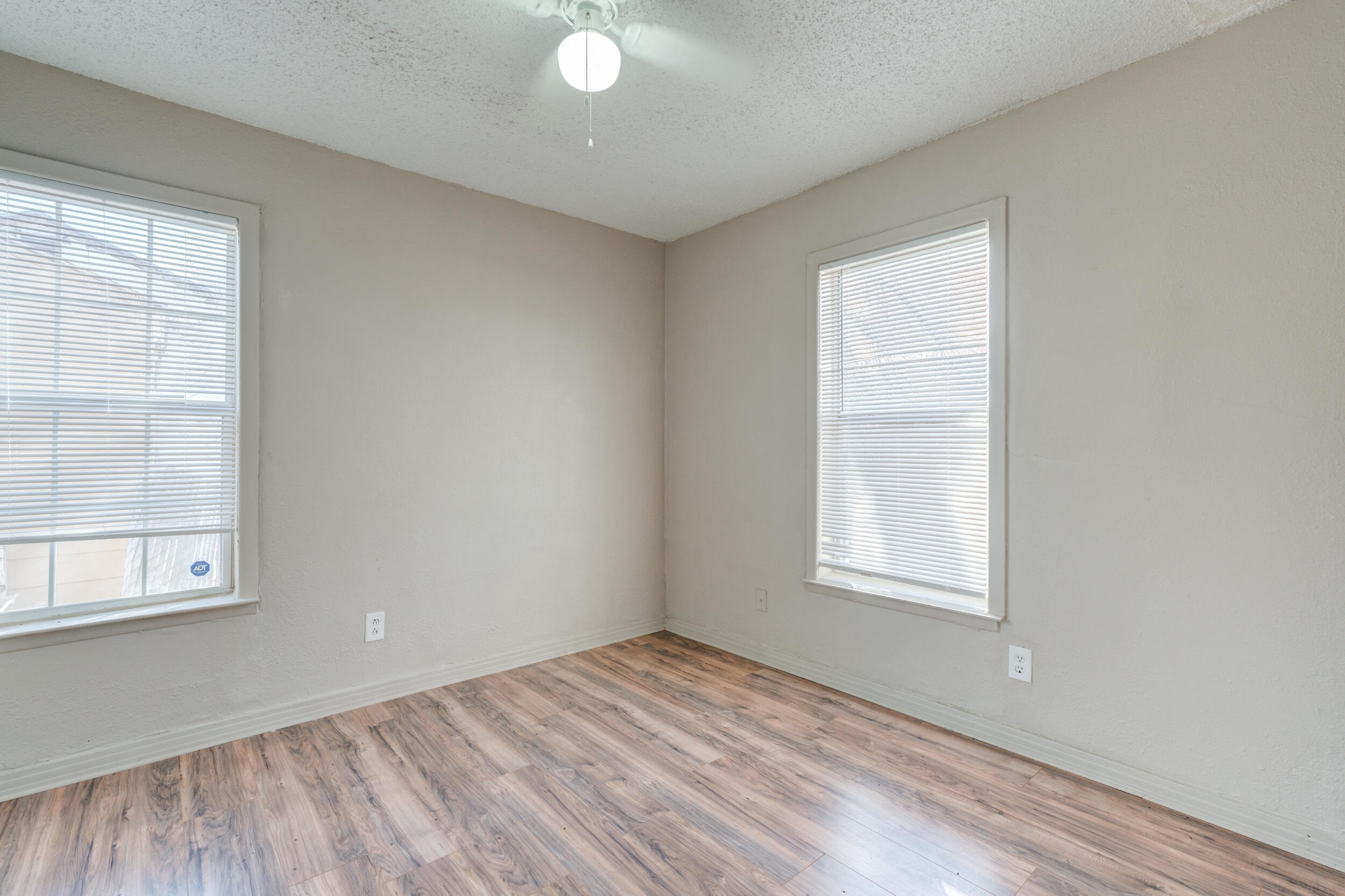 3109 Harvard Street Lubbock, TX 79415 - Photo 23 of 29 an empty room with windows