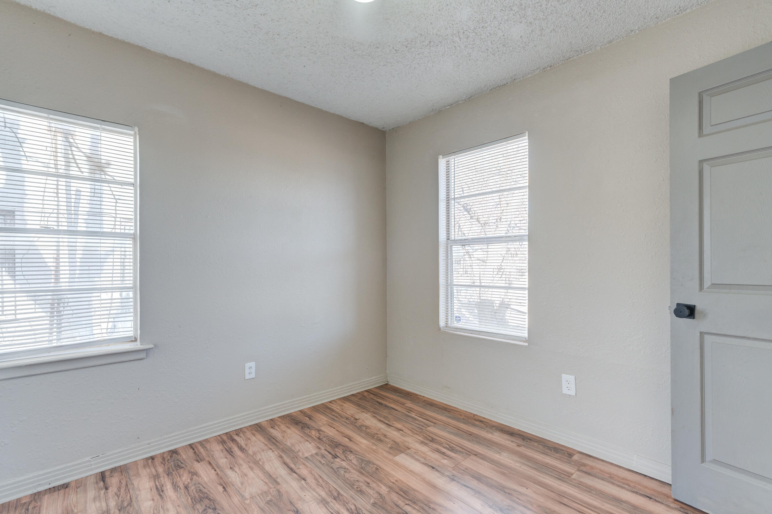 3109 Harvard Street Lubbock, TX 79415 - Photo 26 of 29 an empty room with windows
