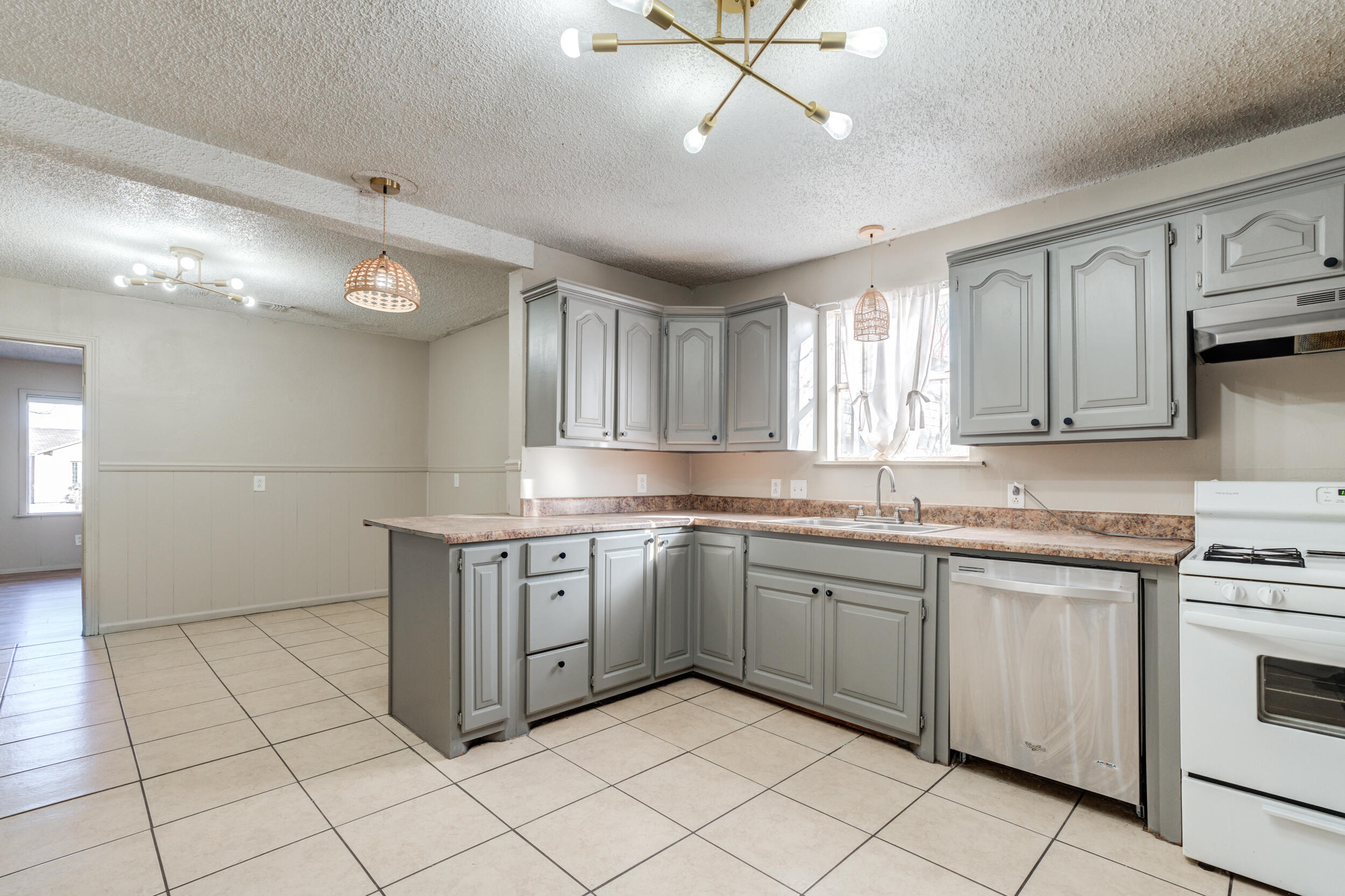 3109 Harvard Street Lubbock, TX 79415 - Photo 8 of 29 a kitchen with a sink window and cabinets