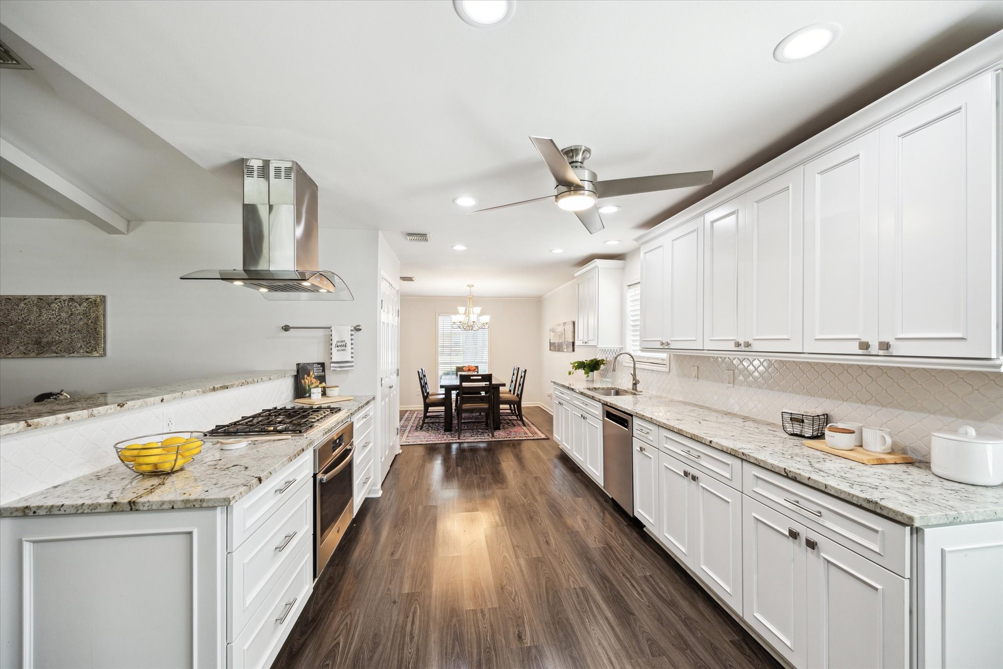 7614 Braesview Lane Houston, TX 77071 - Photo 12 of 29 a kitchen with a stove a sink and a refrigerator