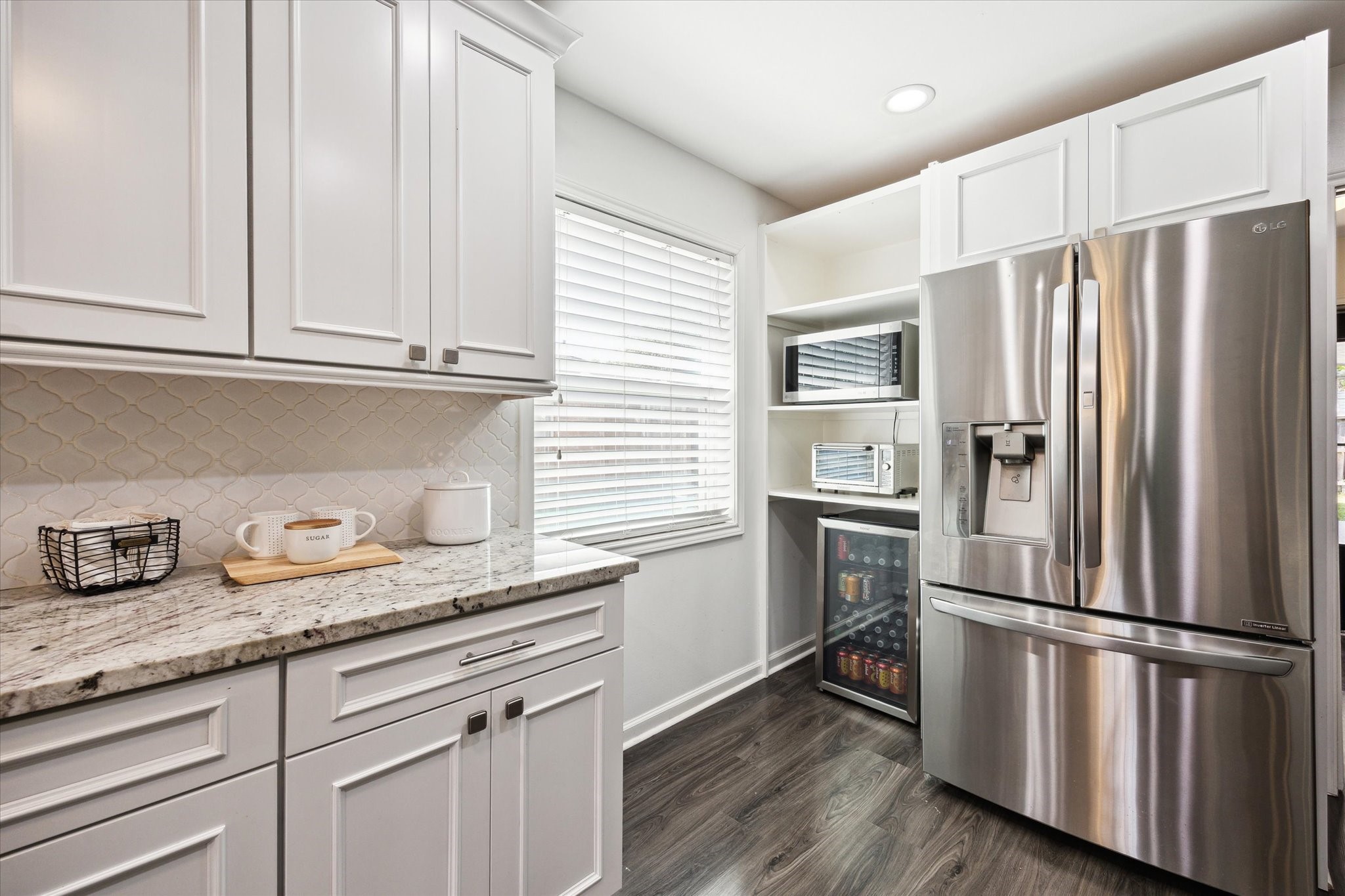 7614 Braesview Lane Houston, TX 77071 - Photo 13 of 29 a kitchen with granite countertop stainless steel appliances a refrigerator and a sink