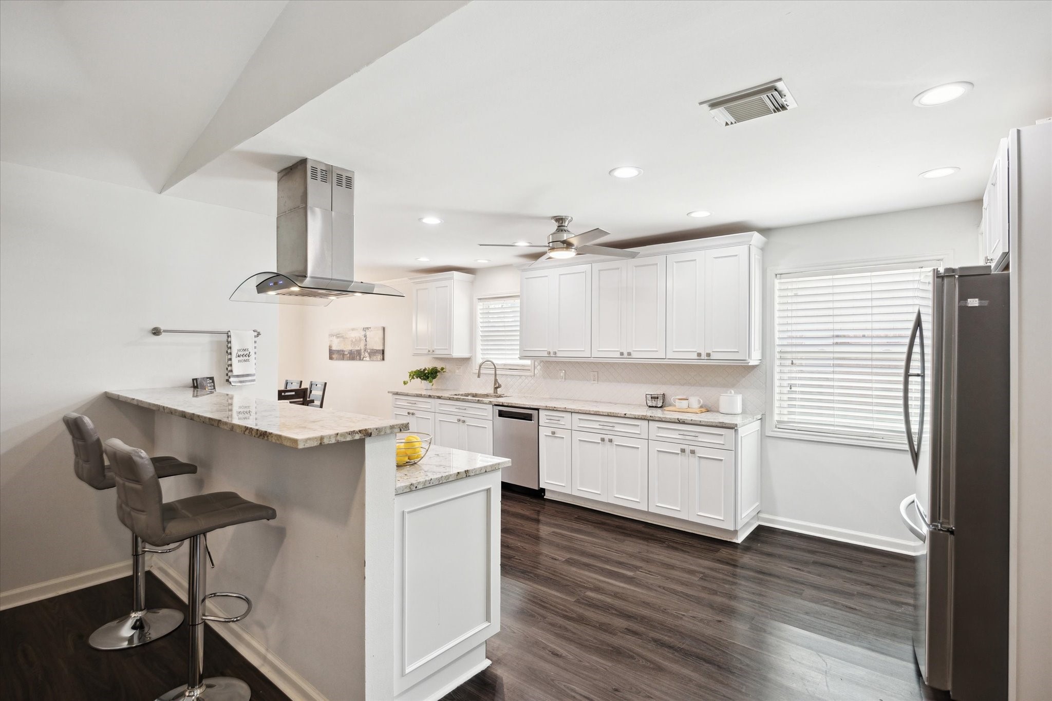 7614 Braesview Lane Houston, TX 77071 - Photo 15 of 29 a kitchen with a sink cabinets and wooden floor